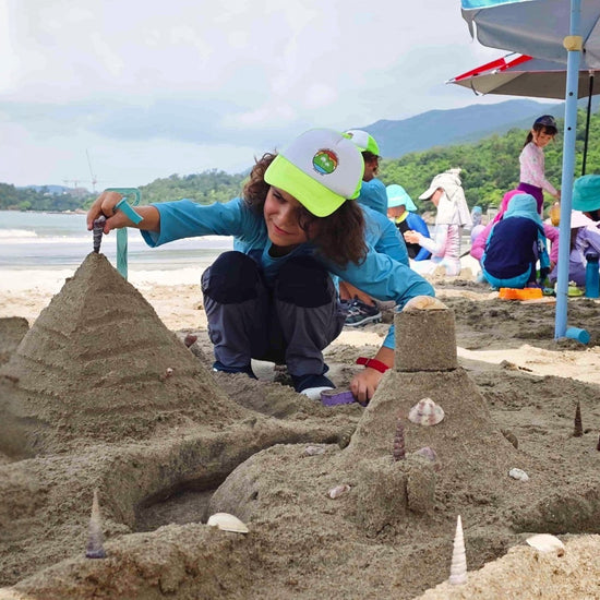 kids learning stem in sand
